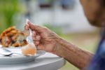 elderly woman eating - malnutrition in nursing home concept